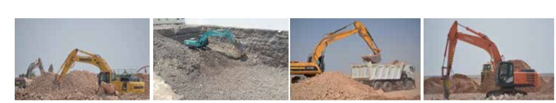 Excavators and a dump truck clearing a building plot